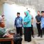 Ketua TP PKK Kota Palembang, Dewi Sastrani Dewa bersama Ketua Baznas Kota Palembang, Kgs. M. Ridwan Nawawi Serahkan Rumah Layak Huni untuk Djasmadi.