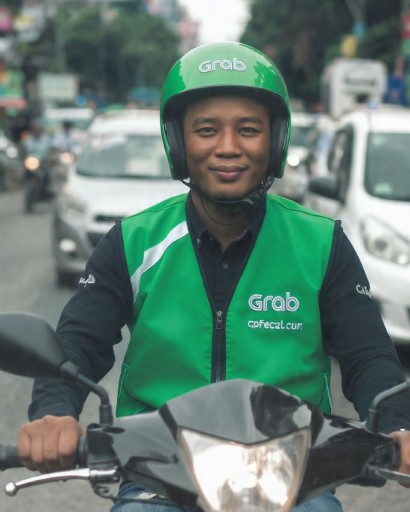 Ilustrasi pengemudi ojek online.