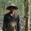 Ilustrasi petani sedang berada di kebun karet.